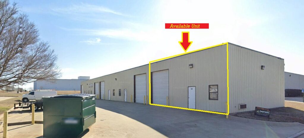 Industrial warehouse unit marked with yellow outline and arrow.