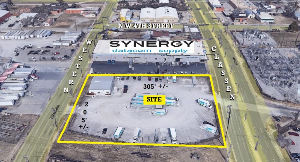 Aerial view of a commercial property site with boundary markings and surrounding streets.